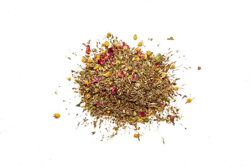 A pile of tea leaves with different colors and shapes.