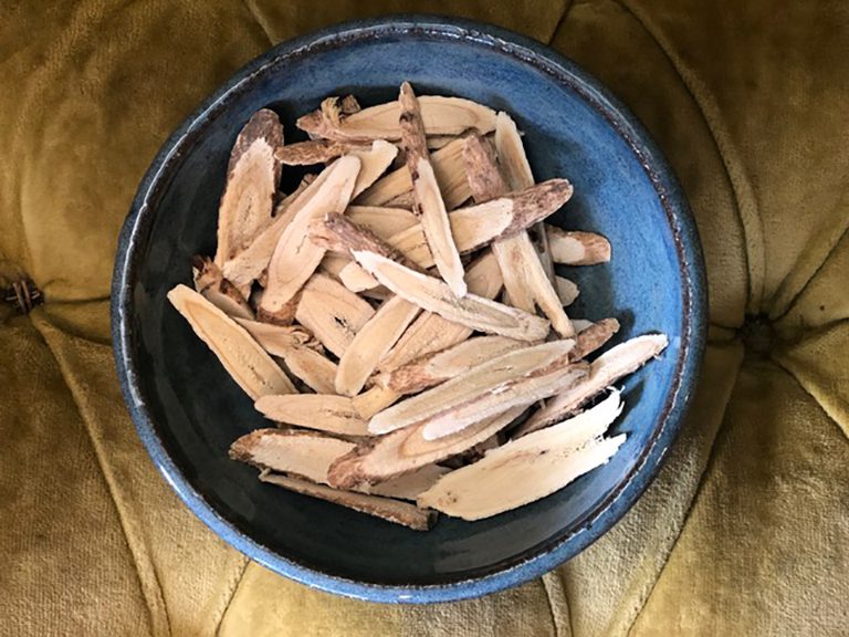 A bowl of wood chips sitting on top of a table.