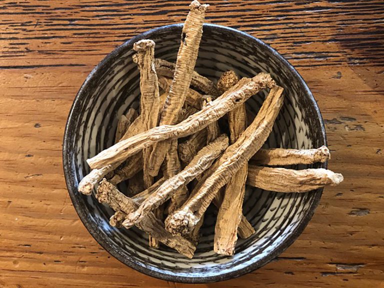 A bowl of dried sticks on top of a table.