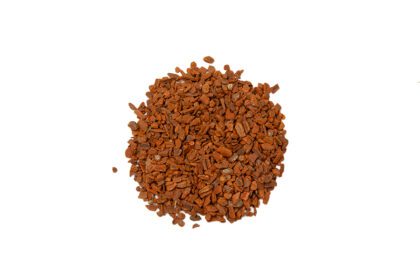 A pile of red gravel on top of white background.