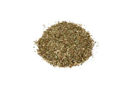 A pile of dried herbs on top of a white background.