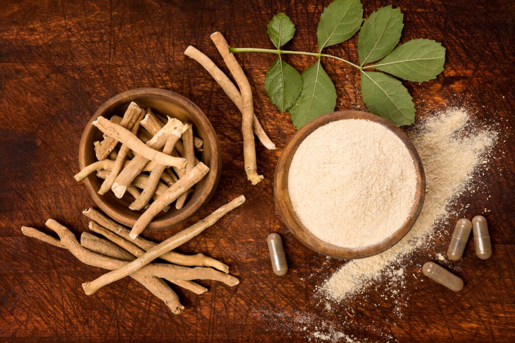 A wooden table topped with bowls of food and powdered.