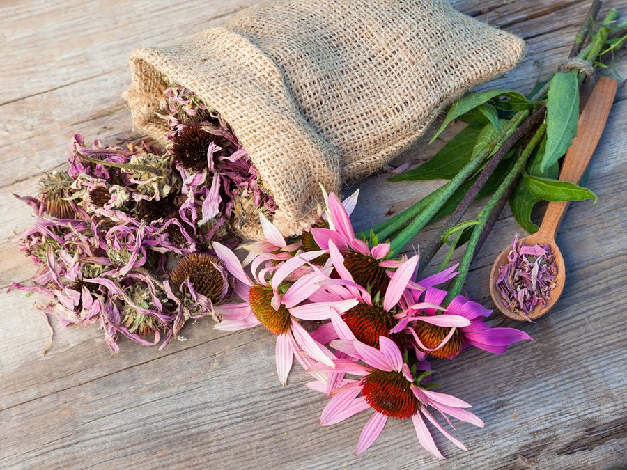 A bag of burlap with flowers on it.