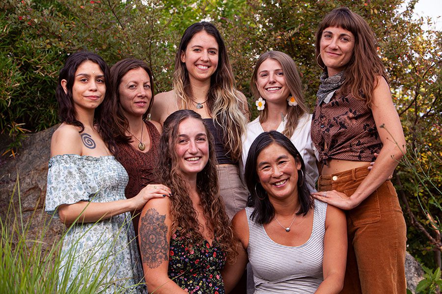 A group of women standing next to each other.